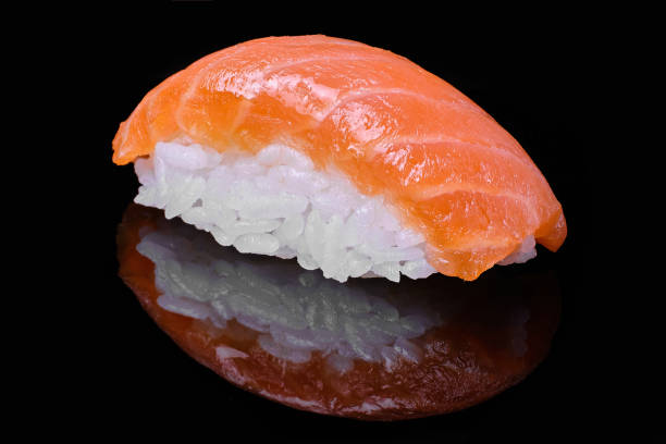 istock Fresh Salmon Sushi on black concrete background. Nigiri or Sashimi. 1456847244