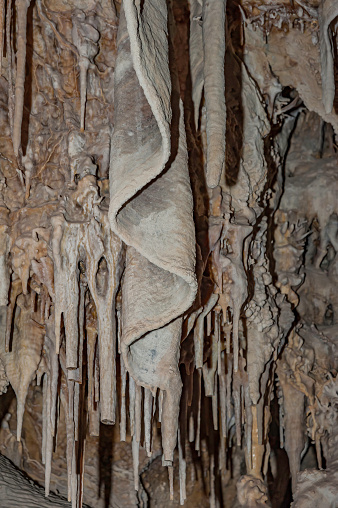 Lehman Cave in Great Basin National Park, near Baker Nevada. In the Snake Mountain Range which contains limestone. The limestone has been removed by water and carbon dioxide to create the cave and the internal structures.