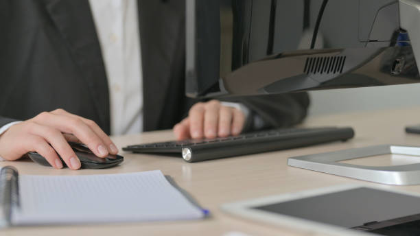 istock Close Up of Young Businesswoman Working on Computer, Typing 1456849737