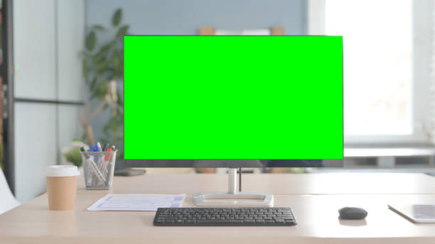 istock Desktop with Green Screen on Desk in Office 1456851942