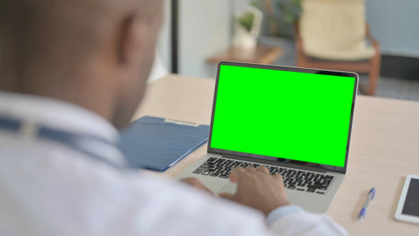 istock African Doctor Using Laptop with Green Screen 1456852374