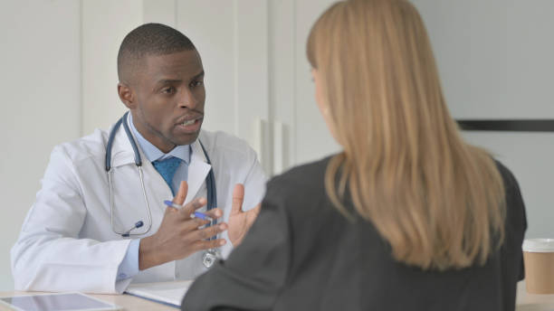 istock African Doctor Talking with Female Patient 1456852500