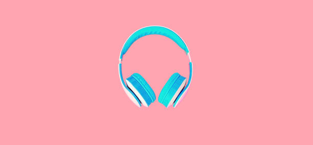 Close up of headphones on colorful pink background, top view stock photo
