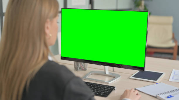 istock Young Businesswoman using Desktop with Green Screen 1456853920