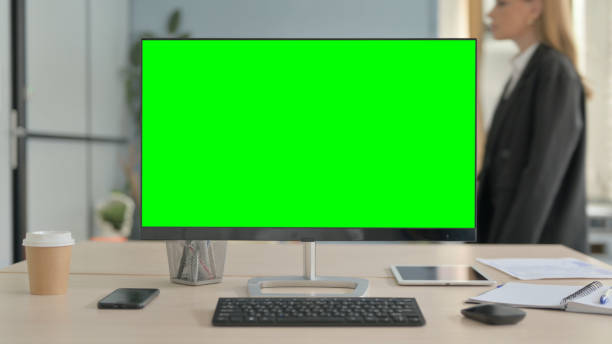 istock Chroma Key Monitor with Green Screen in Office 1456853951