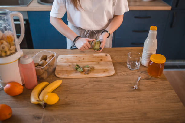 istock An unrecognizable female athlete peels a kiwi and prepares a smoothie 1456854020