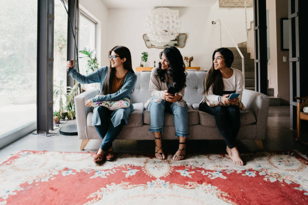 istock Three friends taking a selfie together at home 1456855032