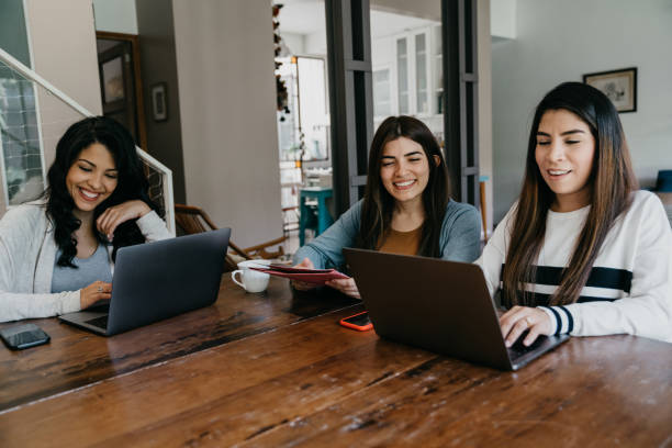istock Three young adult women working together 1456855136