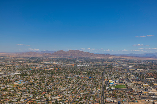 Beautiful aerial panoramic view of Las Vegas with mountain landscape in background. USA.