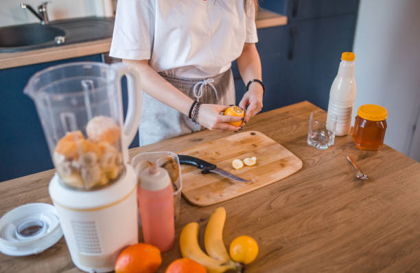 istock An unrecognizable sportswoman peels a lemon and prepares a smoothie 1456855226