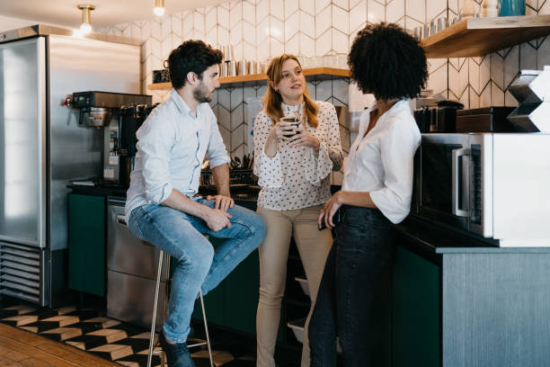 istock Three people having a coffee break at the office. They are drinking yerba mate together. 1456858716