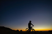 mountain bike silhouette dramatic sky