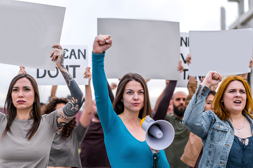 Group of protesters holding blank signs during the demonstration