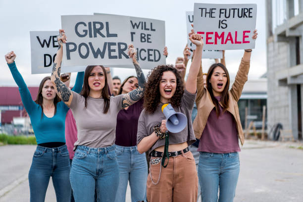 istock Group of women marching for equal rights 1456860077