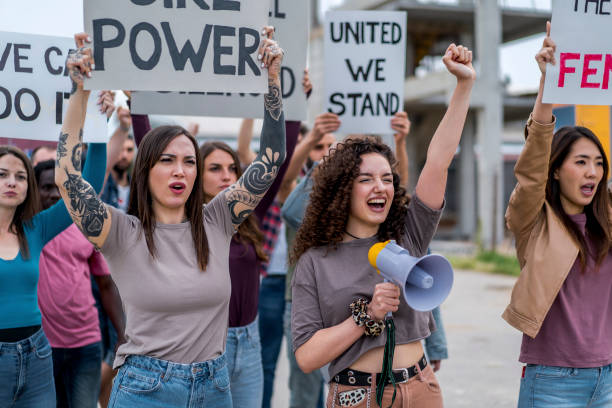 istock Protesters with signs during a demonstration in the street 1456860152