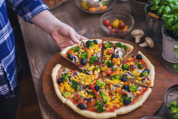 istock Vegetarian Pizza with Broccoli, Cherry Tomato, Pepper and Mushrooms 1456860743