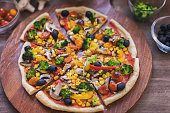 Vegetarian Pizza with Broccoli, Cherry Tomato, Pepper and Mushrooms
