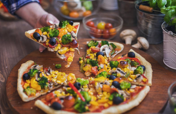 istock Vegetarian Pizza with Broccoli, Cherry Tomato, Pepper and Mushrooms 1456860745
