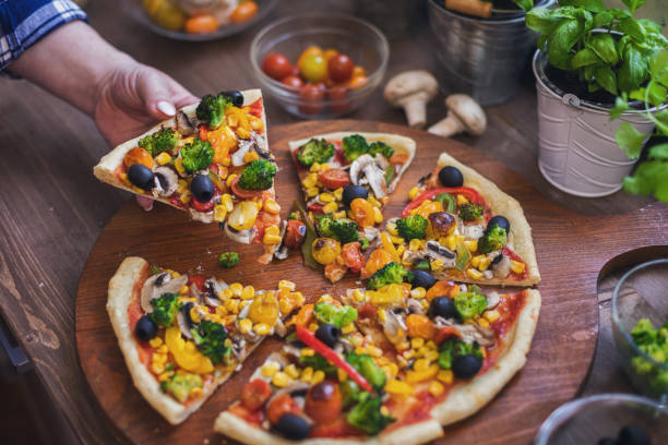 istock Vegetarian Pizza with Broccoli, Cherry Tomato, Pepper and Mushrooms 1456860755