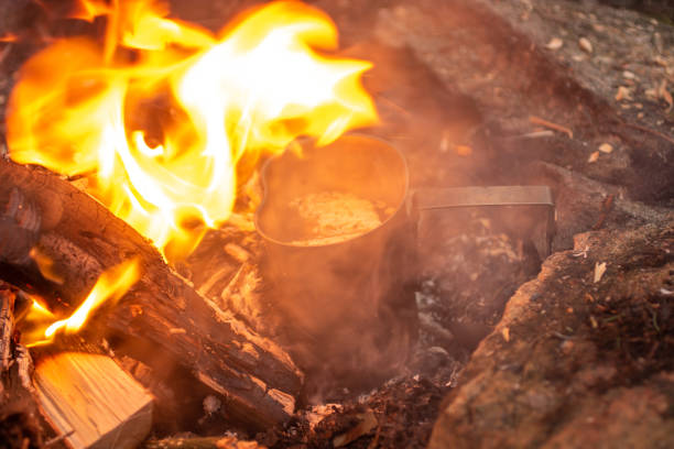 istock Campfire Survival Cooking Kit, boiling noodles at a campfire, 1456863177