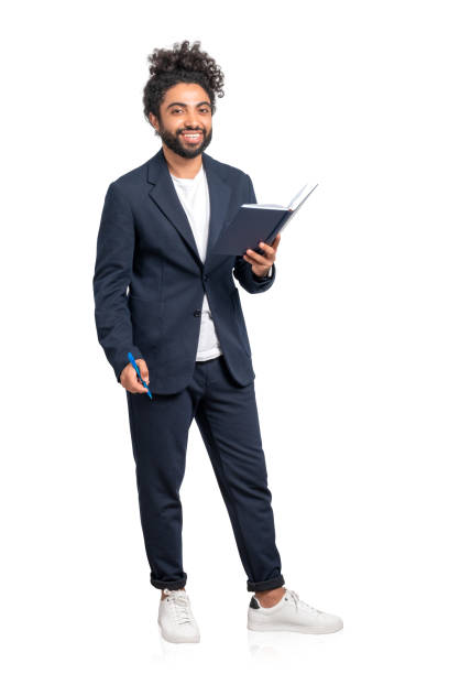 istock Arab businessman with notebook and pen smiling, isolated over white background 1456867330