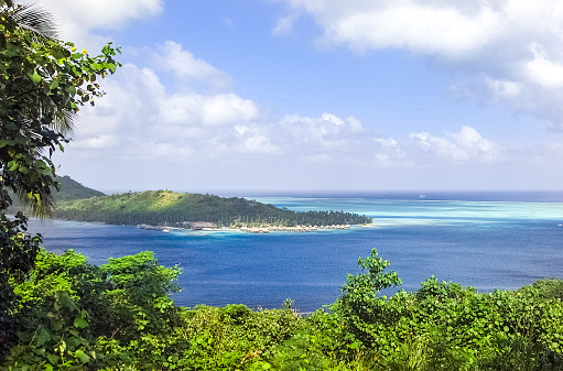 Moorea, French Polynesia - 2001: A view of the lush mountain island of Moorea in French Polynesia with blue clear water on the rare Canon EOS 1N - Kodak DCS 520, one of the first professional digital cameras.