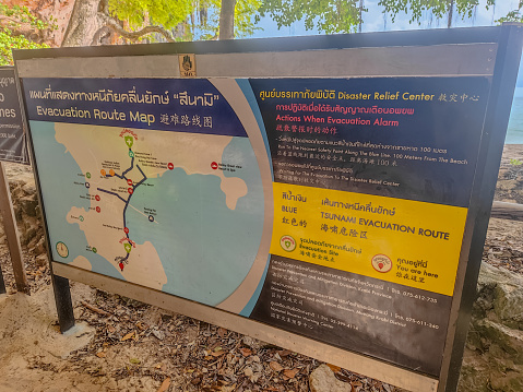 Sign showing tsunami evacuation route and all information about evacuation in Railay beach, Thailand