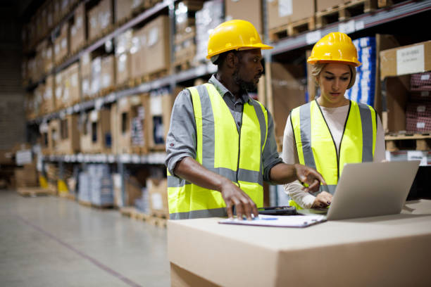 istock Two warehouse workers discussing about logistics and organization in distribution storage area 1456874557
