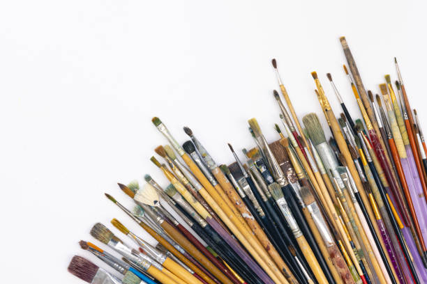 istock Many brushes for painting on a white background, top view. 1456875825