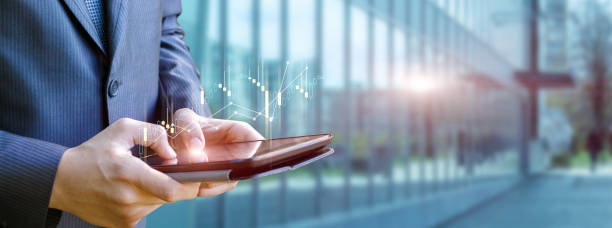 istock A businessman is working on a tablet with profit growth. 1456876245