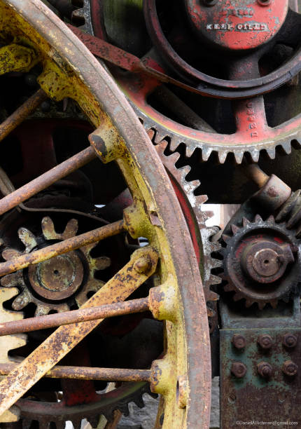 istock Big faded colorful gears on old machinery (tractor). Ironic warning 
