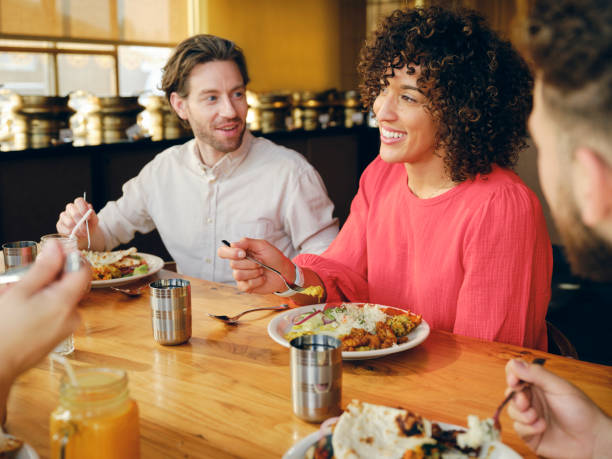 istock Group of Friends at an Indian Restaurant 1456878771
