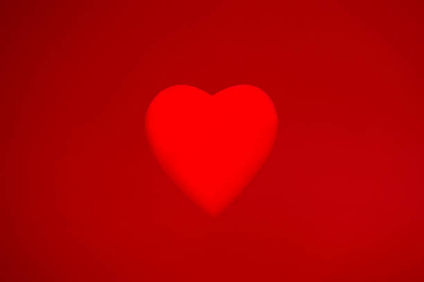 istock Background material for Valentine's Day with a red heart object on a red background 1456879214