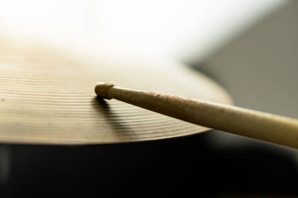 istock Drum stick playing a crash cymbal with the tip 1456879625