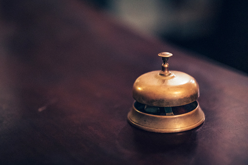 Close up of an old solid brass counter bell.