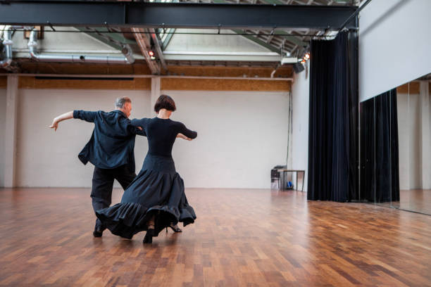 Beautiful couple dancing tango at a rehearsal area stock photo