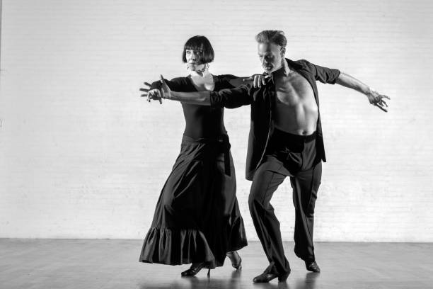 istock Beautiful couple dancing tango together 1456884563