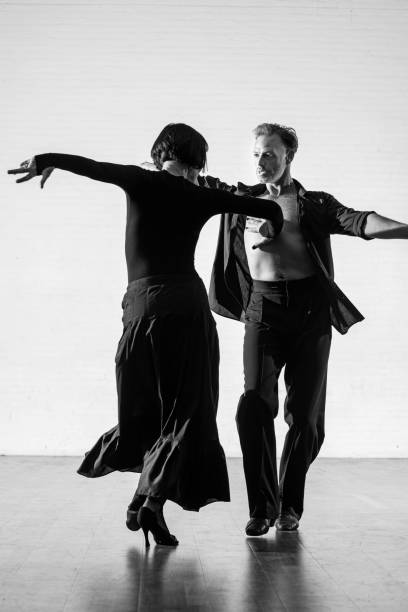 istock Beautiful couple dancing tango together 1456884633