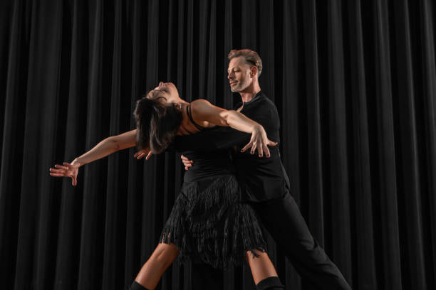 istock Beautiful couple dancing rumba together at a performance 1456884995