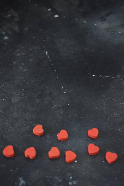 istock Valentine's Day, background with red hearts on a black background. 1456886071