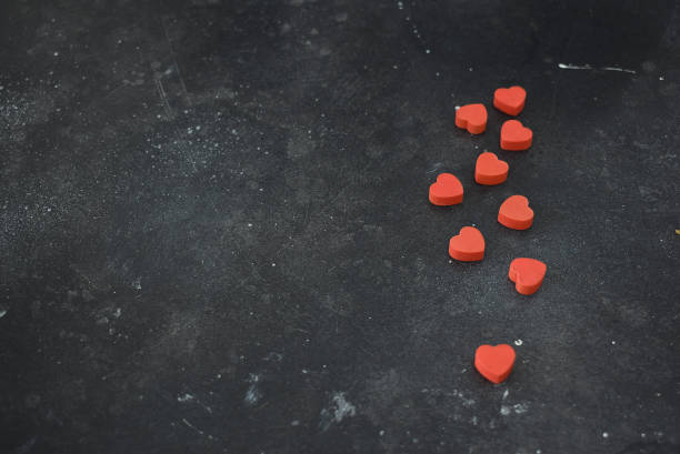 istock Valentine's Day, background with red hearts on a black background. 1456886080