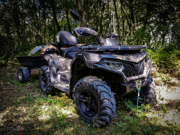 istock ATV parked in the bush with trailer attached 1456886755