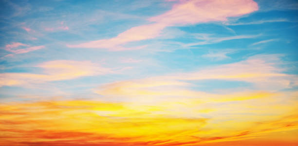 istock Sunset with sun and clouds on blue and orange dramatic sky with sun rays 1456887035