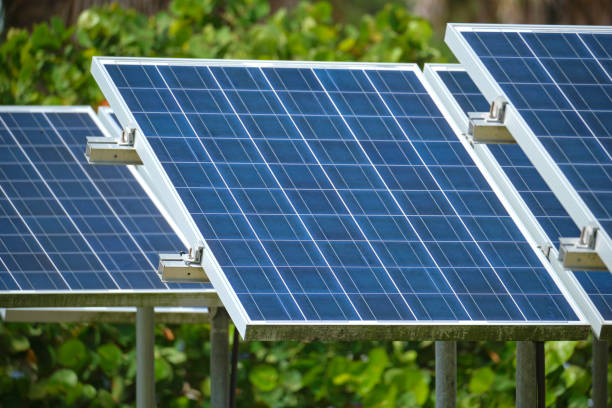 istock Solar photovoltaic panels mounted on stand-alone frame on backyard ground for generating of clean ecological electric energy. Concept of autonomous house 1456888029