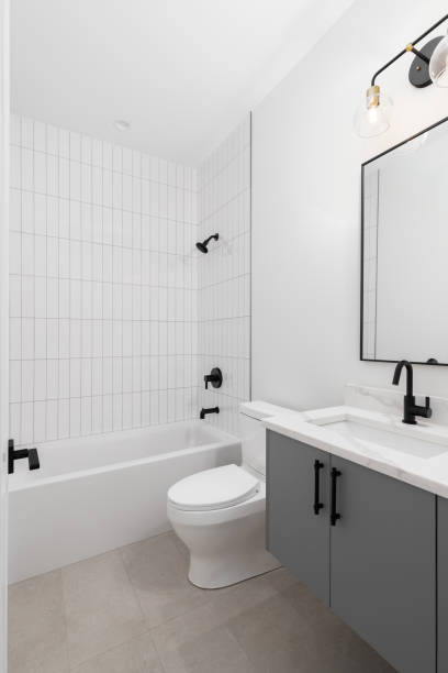 istock A bathroom with a grey cabinet and subway tiled shower. 1456888848