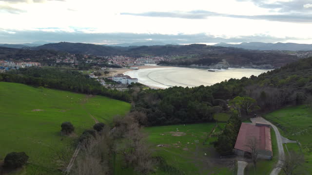 bilbao bizkaia país vasco drone footage filed green nature and mountains and cows and rivers plencia beach