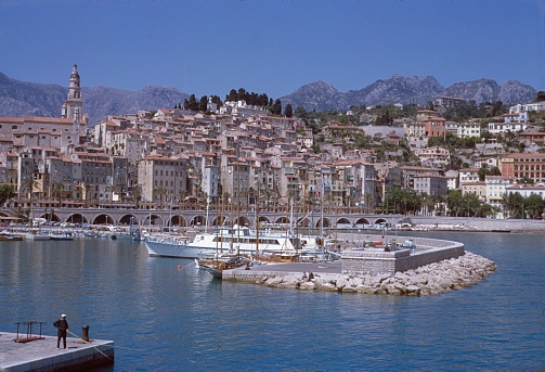Menton, Côte d'Azur, southern France, 1964. The southern French town of Menton with its port on the Côte d'Azur. Also: locals.
