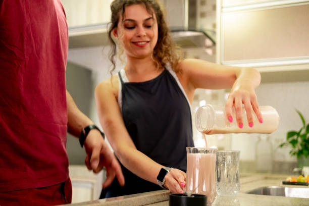 istock Young couple preparing beverages at home. 1456893768