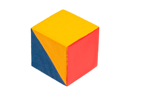 multicolored wooden cubes decorated with a geometric pattern, isolated on a white background