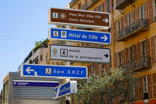 Nice, France - September 20, 2018: Several street signs, which have been placed on one pole and are signposts to important places in the city.